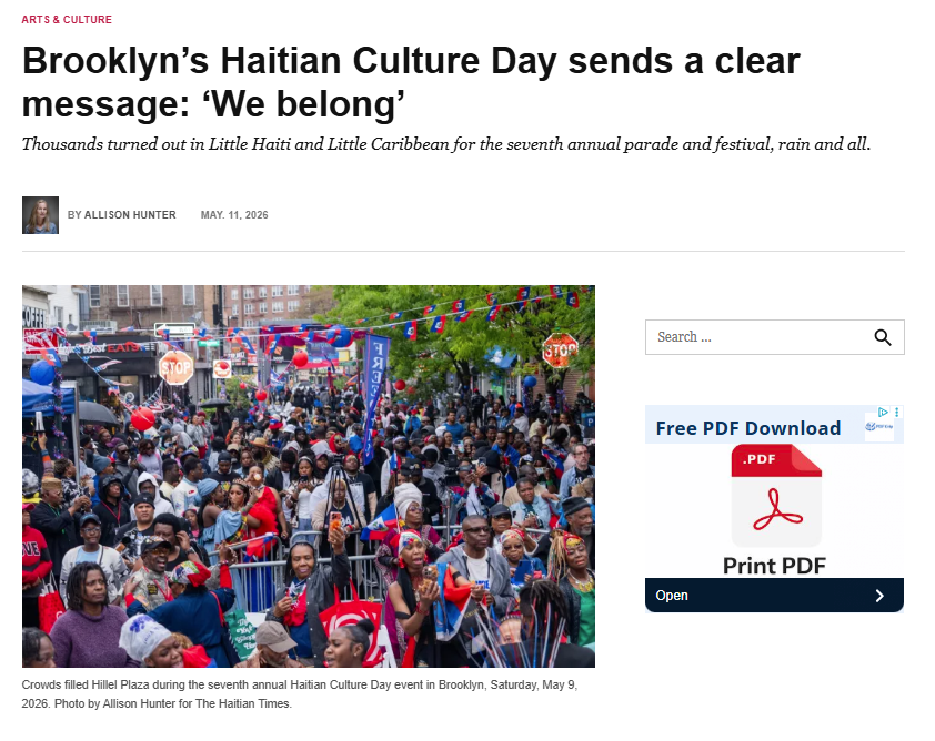 A large crowd fills Hillel Plaza during Brooklyn's seventh annual Haitian Culture Day parade and festival, with Haitian flags, red and blue balloons, and banners visible throughout, Saturday, May 9, 2026.