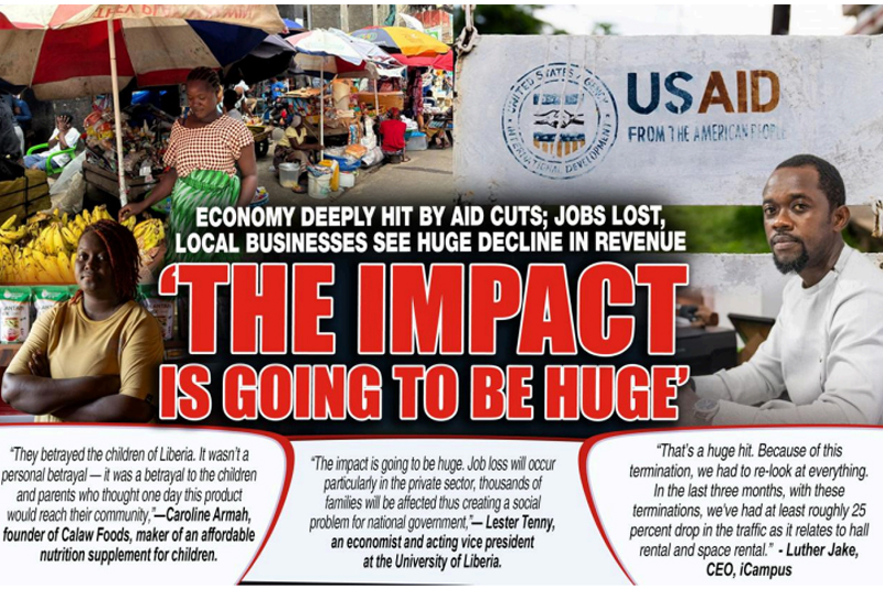 A market vendor in Liberia sits beside colorful produce with a USAID sign visible in the background.
