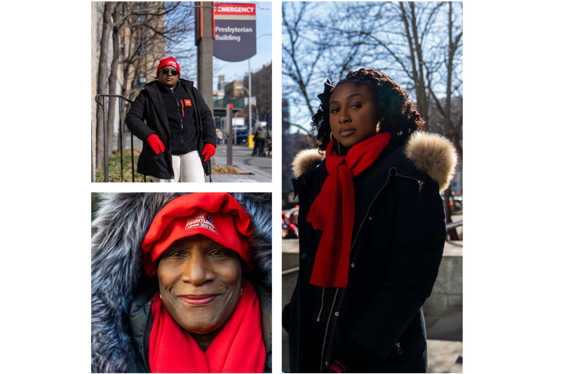 Four Haitian American nurses on strike in red hats and scarves outside a hospital.